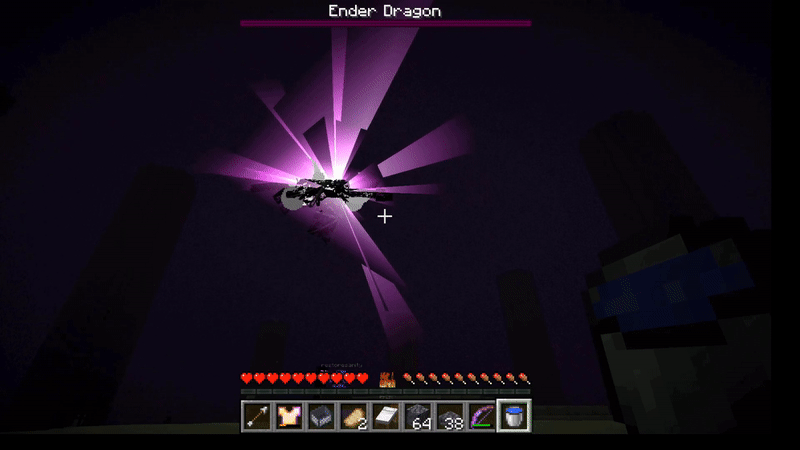 A black dragon made of cubes slowly rises into the air as it disintegrates, a purple light emanating from it, then it explodes.