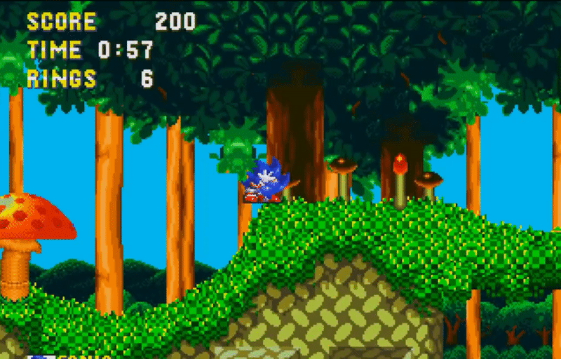 Sonic the Hedgehog from Sonic 3 rolls into a ball then blasts off at high-speed across a vine suspended in a lush green forest.