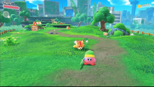 The round pink creature Kirby dodges a charging fox in an open grassy field, as time slows to a crawl. Time resumes as kirby goes in for a switch strike with his sword.